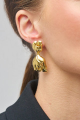 Profile view of model wearing the Oroton Tulip Drop Earrings in Gold and Brass for Women