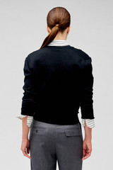 Profile view of model wearing the Oroton Wrap Cardigan in Black and 100% merino wool for Women