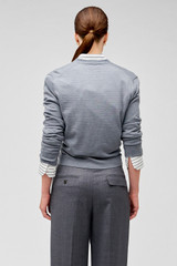 Profile view of model wearing the Oroton Wrap Cardigan in Grey Marle and 100% merino wool for Women