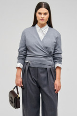 Profile view of model wearing the Oroton Wrap Cardigan in Grey Marle and 100% merino wool for Women