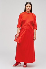 Profile view of model wearing the Oroton Split Neck Dress in True Red and 100% silk for Women