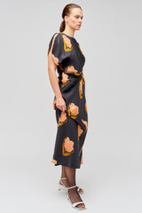 Profile view of model wearing the Oroton Linear Tulip Print Dress in Black and 100% silk for Women