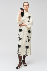 Profile view of model wearing the Oroton Graphic Floral Print Dress in Antique Cream and 81% viscose, 19% linen for Women