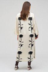 Profile view of model wearing the Oroton Graphic Floral Print Dress in Antique Cream and 81% viscose, 19% linen for Women