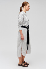 Profile view of model wearing the Oroton Pinstripe Shirt Dress in White and 100% cotton for Women
