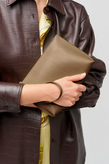 Profile view of model wearing the Oroton Mia Texture Pouch in Wicker and Textured leather for Women