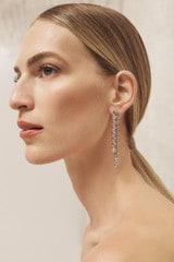 Profile view of model wearing the Oroton Lori Drop Earrings in Silver and Brass for Women