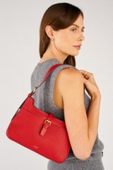 Profile view of model wearing the Oroton Dylan Baguette in Dark Ruby and Pebble Leather for Women