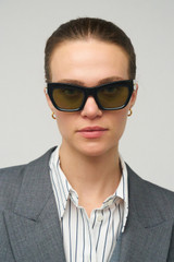 Profile view of model wearing the Oroton Sebes Sunglasses in Black and Bio acetate (Biodegradeable) for Women