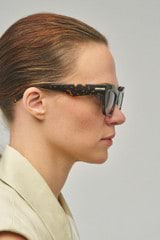 Profile view of model wearing the Oroton Sebes Sunglasses in Neo Tort and Bio acetate (Biodegradeable) for Women