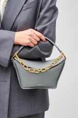 Profile view of model wearing the Oroton Fable Small Day Bag in Grey Flannel and Smooth leather for Women