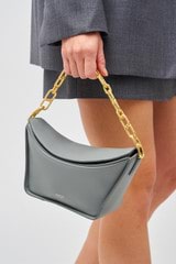 Profile view of model wearing the Oroton Fable Small Day Bag in Grey Flannel and Smooth leather for Women