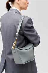 Profile view of model wearing the Oroton Florence Bag Strap in Grey Flannel and Smooth leather for Women