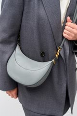 Profile view of model wearing the Oroton Florence Small Shoulder Bag in Grey Flannel and Smooth leather for Women