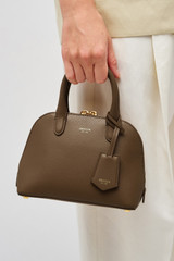 Profile view of model wearing the Oroton Muse Micro Griptop in Wicker and Two tone saffiano/smooth leather for Women