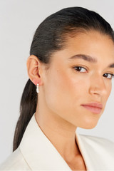 Profile view of model wearing the Oroton Kimberley Pearl Thread Earrings in Gold/Pearl and Brass for Women