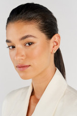 Profile view of model wearing the Oroton Leah Stud Earrings in Gold and Stainless Steel for Women