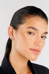 Profile view of model wearing the Oroton Leah Stud Earrings in Silver and Stainless Steel for Women