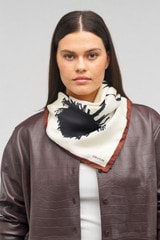 Profile view of model wearing the Oroton Graphic Floral Scarf in Cream and 100% silk for Women