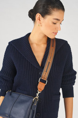Profile view of model wearing the Oroton Heather Long Webbing Strap in Navy/Cognac and 100% Jacqard webbing for Women