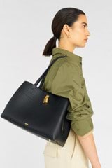 Profile view of model wearing the Oroton Tate Three Pocket Day Bag in Black and Pebble leather for Women