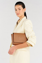 Profile view of model wearing the Oroton Polly Crossbody in Tan and Pebble leather for Women