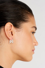 Profile view of model wearing the Oroton Leah Hoop Earrings in Silver and Stainless Steel for Women