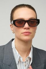 Profile view of model wearing the Oroton Nadja Sunglasses in Signature Tort and Bio acetate (Biodegradeable) for Women