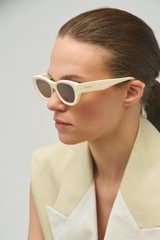 Profile view of model wearing the Oroton Nadja Sunglasses in Cream and Acetate for Women
