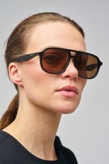 Profile view of model wearing the Oroton Rupea Sunglasses in Black and Bio acetate (Biodegradeable) for Women