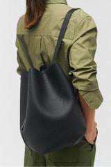 Profile view of model wearing the Oroton Ellis Hobo in Black and Pebble leather for Women