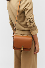 Profile view of model wearing the Oroton Etta Large Day Bag in Amber and Smooth leather for Women