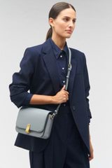 Profile view of model wearing the Oroton Etta Large Day Bag in Grey Flannel and Smooth leather for Women