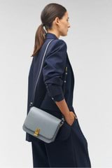 Profile view of model wearing the Oroton Etta Large Day Bag in Grey Flannel and Smooth leather for Women