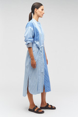 Profile view of model wearing the Oroton Mixed Stripe Shirt Dress in Workwear Blue and 100% cotton for Women