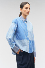 Profile view of model wearing the Oroton Mixed Stripe Overshirt in Workwear Blue and 100% cotton for Women