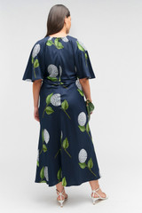 Profile view of model wearing the Oroton Snowdrop Print Dress in North Sea and 100% silk for Women