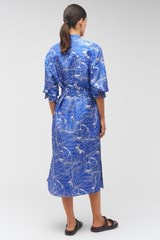 Profile view of model wearing the Oroton Map Print Shirt Dress in Indigo and 100% silk for Women