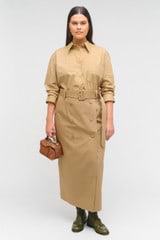 Profile view of model wearing the Oroton Wrap Utility Skirt in Dark Camel and 65% polyester, 35% cotton for Women