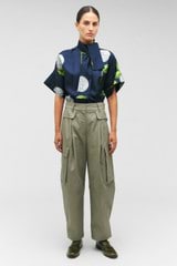 Profile view of model wearing the Oroton Cargo Pant in Sage and 100% cotton for Women