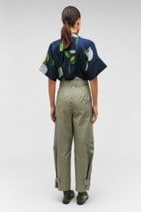 Profile view of model wearing the Oroton Cargo Pant in Sage and 100% cotton for Women