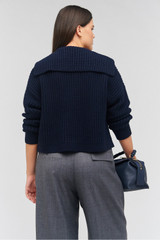 Profile view of model wearing the Oroton Rib Cardigan in North Sea and 50% wool, 50% cotton for Women