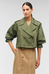 Profile view of model wearing the Oroton Crop Trench in Green Olive and 65% polyester, 35% cotton for Women