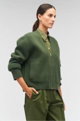 Profile view of model wearing the Oroton Knit Bomber in Green Olive and 100% wool for Women