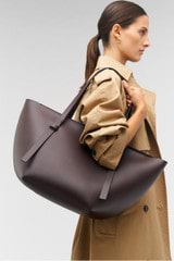 Profile view of model wearing the Oroton Ellis Medium Tote in Mahogany and Smooth leather for Women