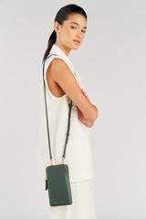 Profile view of model wearing the Oroton Lilly Phone Crossbody in Fern and Pebble leather for Women