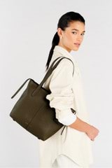 Profile view of model wearing the Oroton Lilly Small Shopper Tote in Olive and Pebble leather for Women
