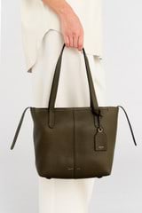 Profile view of model wearing the Oroton Lilly Small Shopper Tote in Olive and Pebble leather for Women