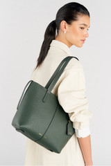 Profile view of model wearing the Oroton Lilly Small Shopper Tote in Fern and Pebble leather for Women