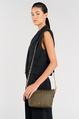 Profile view of model wearing the Oroton Lilly Zip Top Crossbody in Olive and Pebble leather for Women